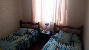 Cama o camas de una habitación en Casa en Coquimbo Sindempart