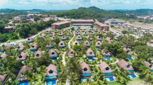 an aerial view of a resort with palm trees at Eco Resort - Praia dos Carneiros in Praia dos Carneiros