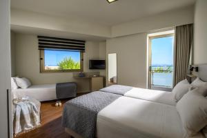 Postel nebo postele na pokoji v ubytování Marin Hotel + 37 fotografií