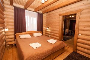 Postel nebo postele na pokoji v ubytování Guest house М