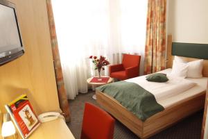Postel nebo postele na pokoji v ubytování Hotel Barbara
