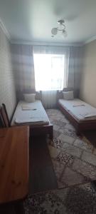 Ένα ή περισσότερα κρεβάτια σε δωμάτιο στο Готель Адріана