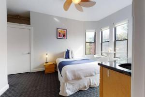 a hotel room with a bed and a sink at Cozy Downtown Boston Studio, #45 in Boston