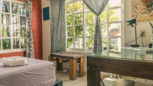 Postel nebo postele na pokoji v ubytování Casa del Pintor Chetumal