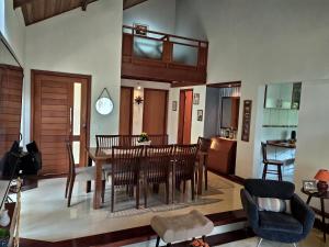 a dining room with a table and chairs at KasaBella Monte Verde in Monte Verde