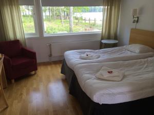 Letto o letti in una camera di Toftastrand Hotell