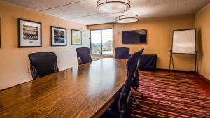 a conference room with a large wooden table and chairs at Best Western Plus Knoxville Cedar Bluff in Knoxville