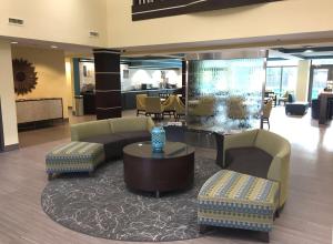a lobby with couches and a fish tank at Best Western Plus Birmingham Inn & Suites in Birmingham