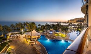 an aerial view of a resort with a swimming pool at Radisson Blu Resort Gran Canaria in La Playa de Arguinegu&iacute;n