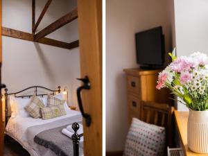 a bedroom with a bed and a vase of flowers at Hush Cottage in Middleton in Teesdale