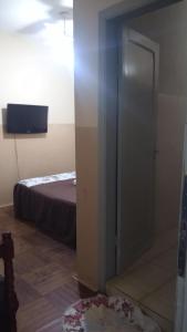 Ein Bett oder Betten in einem Zimmer der Unterkunft Hotel Brasil