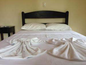 Ein Bett oder Betten in einem Zimmer der Unterkunft Águas Vivas Hotel Fazenda
