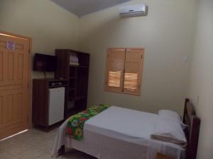 Ein Bett oder Betten in einem Zimmer der Unterkunft Águas Vivas Hotel Fazenda