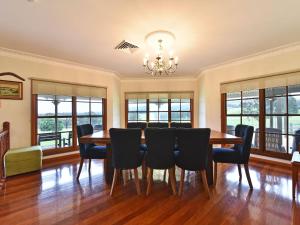 a dining room with a table and chairs at Marrowbone Mountain Views in Pokolbin