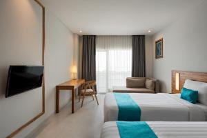 Katil atau katil-katil dalam bilik di Pollos Hotel & Gallery