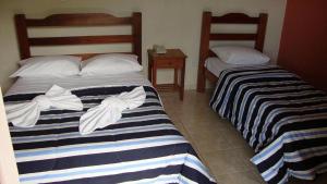 Ein Bett oder Betten in einem Zimmer der Unterkunft Águas Vivas Hotel Fazenda