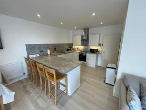 a kitchen with a large island in a room at 10 Argyle Court in Whitby