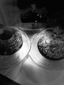 two donuts on a glass plate on a table at Boutique Hotel Palazzo Corso Umberto in Boiano