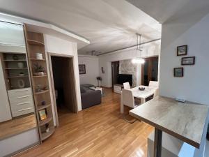 a living room with a kitchen and a dining room at Apartment Old Town Ivo in Makarska