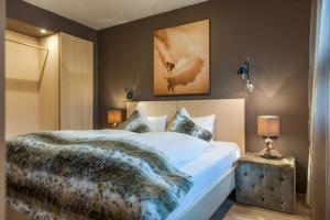 Postel nebo postele na pokoji v ubytování Arlsuites