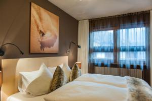 Postel nebo postele na pokoji v ubytování Arlsuites