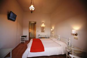Postel nebo postele na pokoji v ubytování Mirini Hotel