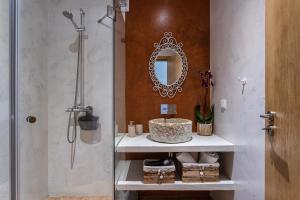 a bathroom with a shower and a sink and a mirror at Sunset Room - Hiking & Beach in Odeceixe