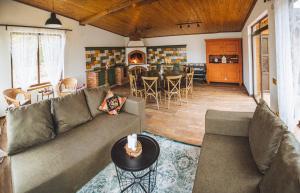 a living room with a couch and a table at Dacha in Uzhhorod