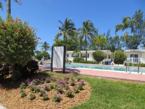 a park with a fountain and trees at Seaside Inn in Sanibel
