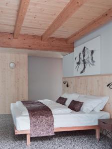 Postel nebo postele na pokoji v ubytování Locanda Via Priula
