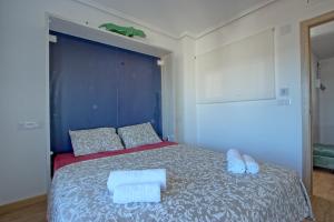 Łóżko lub łóżka w pokoju w obiekcie 055 - Gran Playa Views - comfortHOLIDAYS