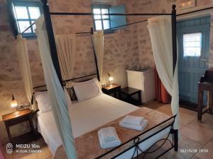 Posteľ alebo postele v izbe v ubytovaní Petrounis Hotel