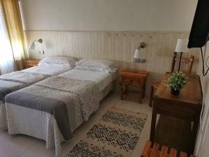 Postel nebo postele na pokoji v ubytování Hotel Las Truchas