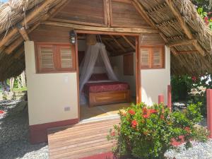 
a bed room with a canopy over the top of it at Cabañas Tucan RNT 52523 in Capurganá
