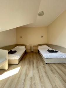 Voodi või voodid majutusasutuse Penzion Apartmány Adamčík toas