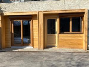 two entry doors to a building with at Le terrier in Vaujany