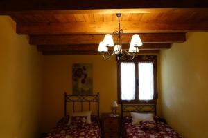 Posteľ alebo postele v izbe v ubytovaní Casa Rural La Cija del Abuelo a 1 hora de Madrid