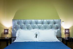 Uma cama ou camas num quarto em Hotel Tulipa