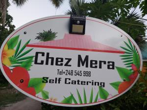 a sign with a picture of a bear on it at Chez Mera Self Catering in La Digue