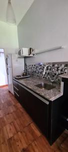 Kuchyň nebo kuchyňský kout v ubytování Apart y Suite Portal del Luz