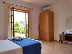 Postel nebo postele na pokoji v ubytování Il Limoneto 2, casa vacanze Parghelia-Tropea