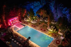 an overhead view of a swimming pool at night at Villa Paradise in Aghmat
