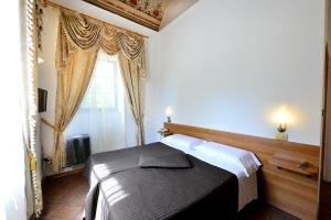 Postel nebo postele na pokoji v ubytování Hotel Iris