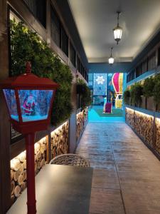 a walkway with a light on the side of a building at Hotel Borneo in Pančevo