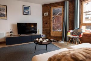 Μια τηλεόραση ή/και κέντρο ψυχαγωγίας στο Appartement Prestige Manoir de Savoie - Arc 1950 le Village