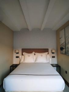 เตียงในห้องที่ Hotel Boutique Casa del Comendador