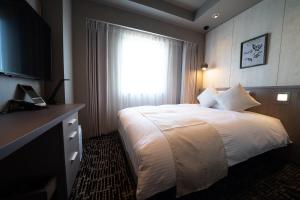 Letto o letti in una camera di Hotel Grand View Takasaki