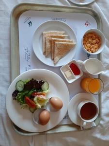 Možnosti snídaně pro hosty v ubytování Bhambri Expo House