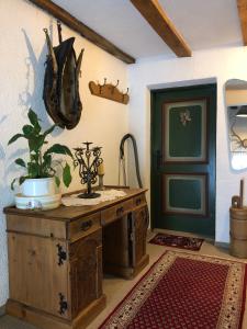 a room with a table with a plant and a door at Haus Theresia in Langen am Arlberg
