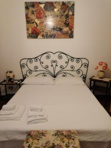 Кровать или кровати в номере Le Stanze di Rosa